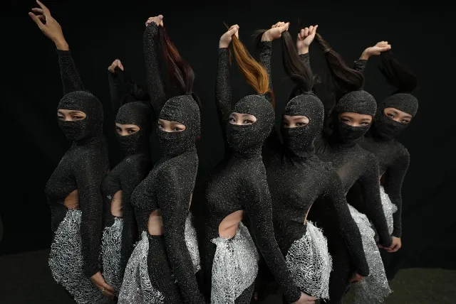 Contemporary dancers in a coordinated formation