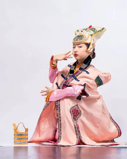 Young dancer in a pink traditional costume